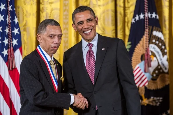 George R. Carruthers shaking hands with President Barack Obama, 2013